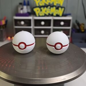 White and Red Poké Ball Figures